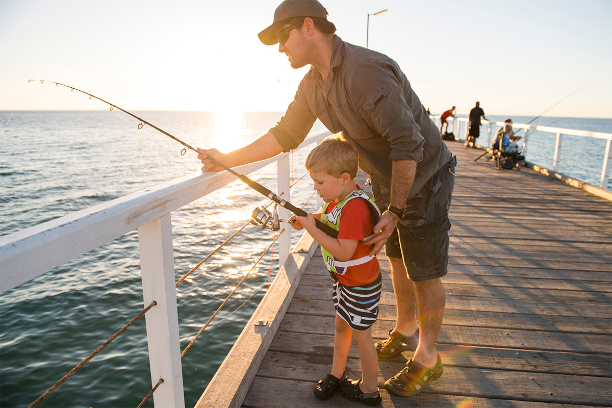 kids fishing with dad